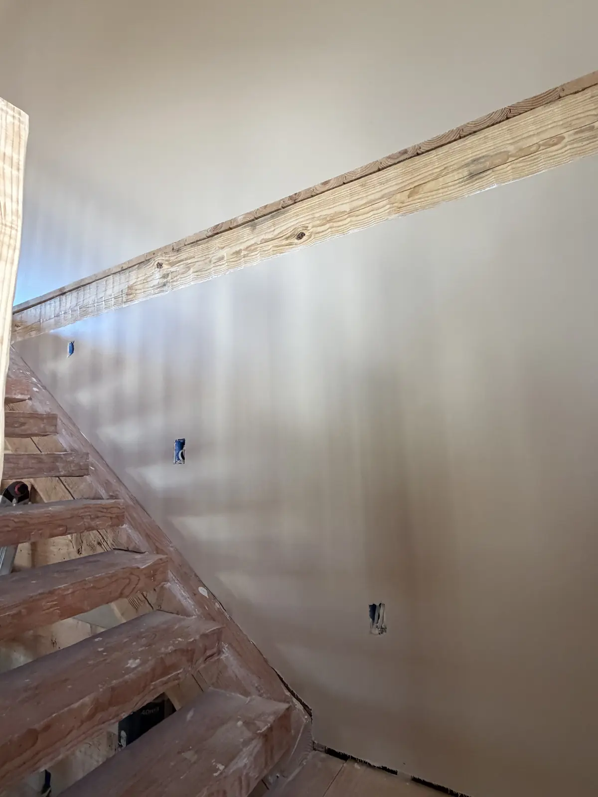 Residential drywall preparation underway before painting.