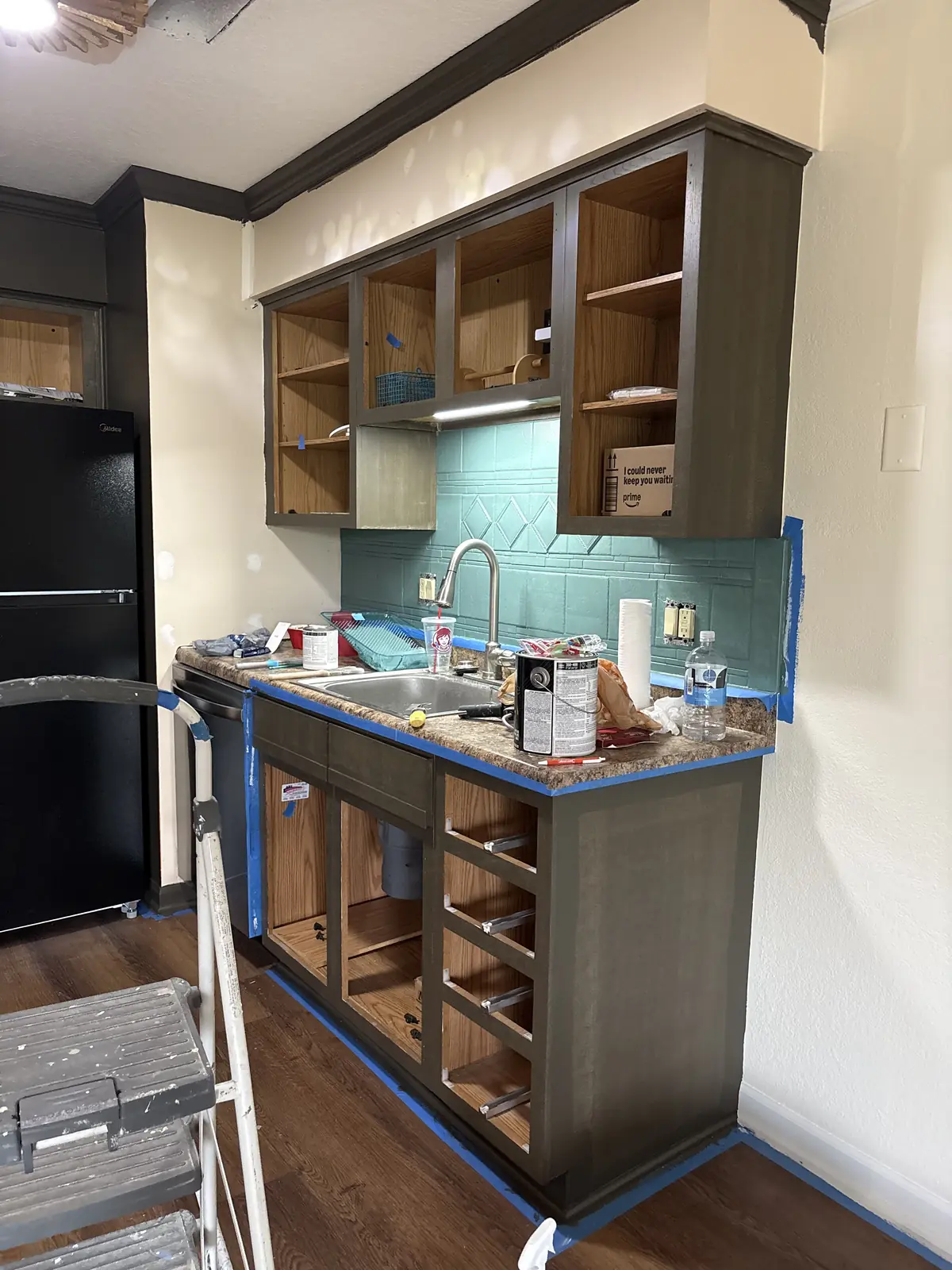 Residential kitchen cabinets prepared for a refreshed finish.